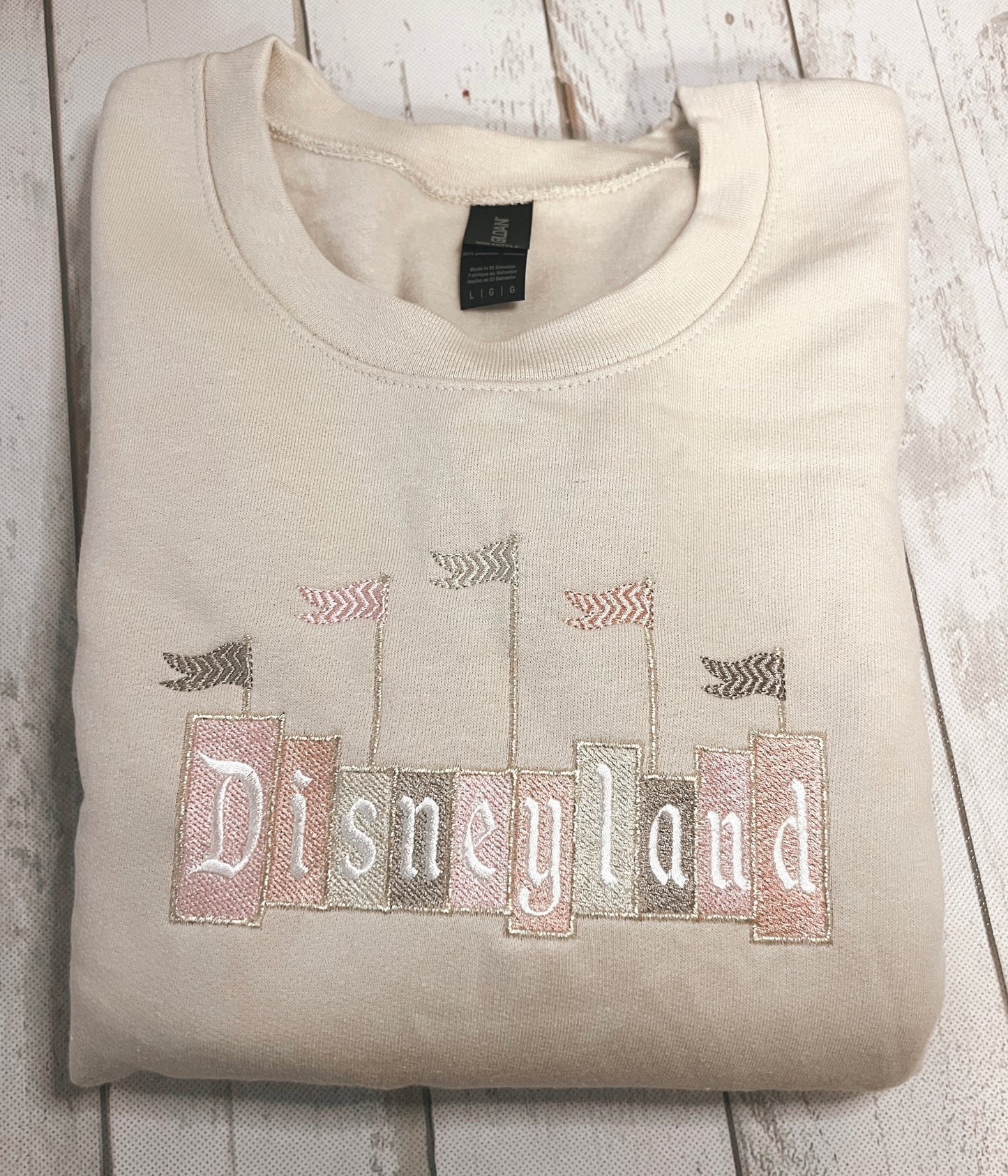 Neutral Disneyland Sign Embroidered Crewneck
